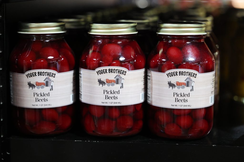 Jars of pickled beets on shelf