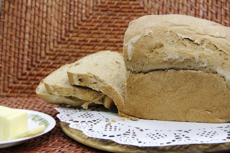 Freshly baked bread, sliced and ready to eat
