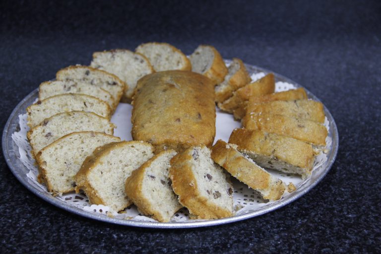 Banana nut bread displayed in a very attractive manner on a large platter