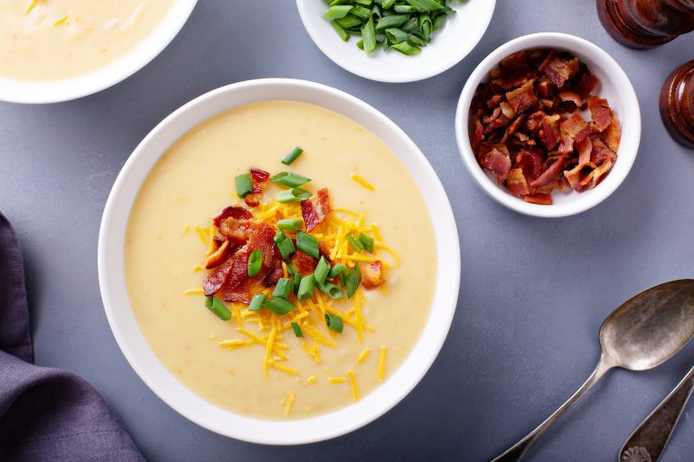 Potato cream soup with bacon, green onion and cheese overhead